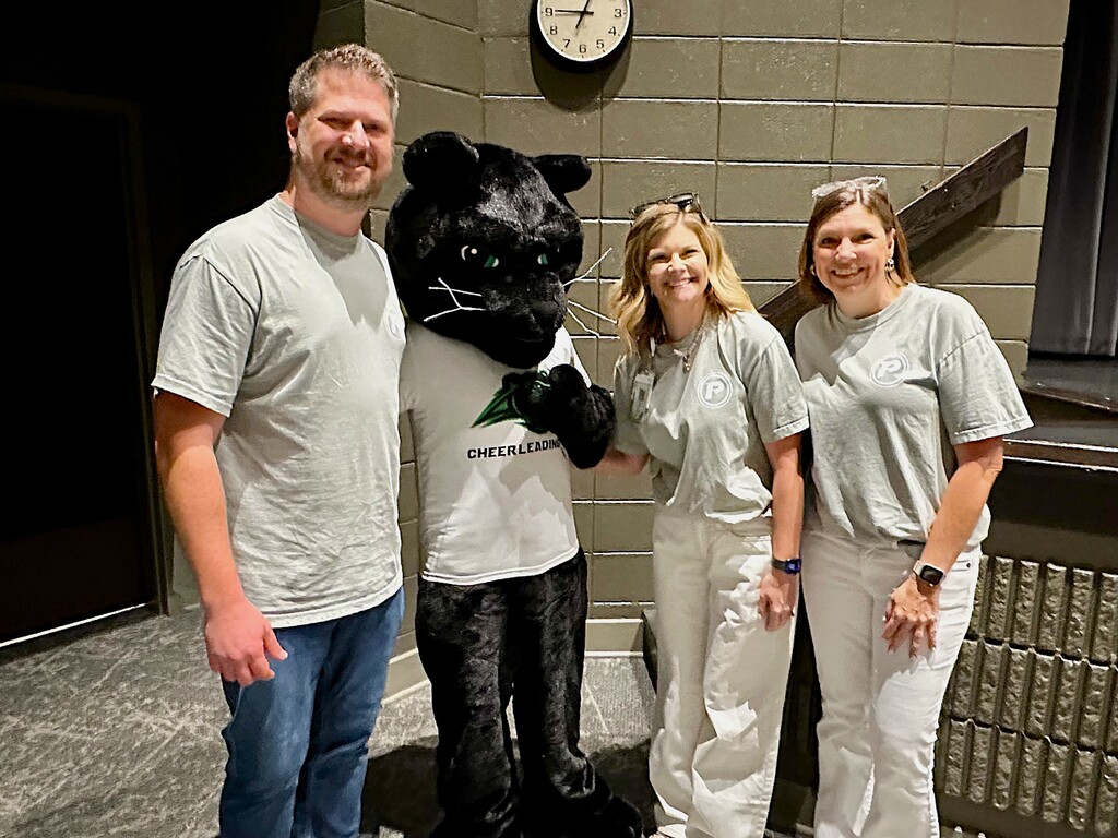 School administrators with panther mascot