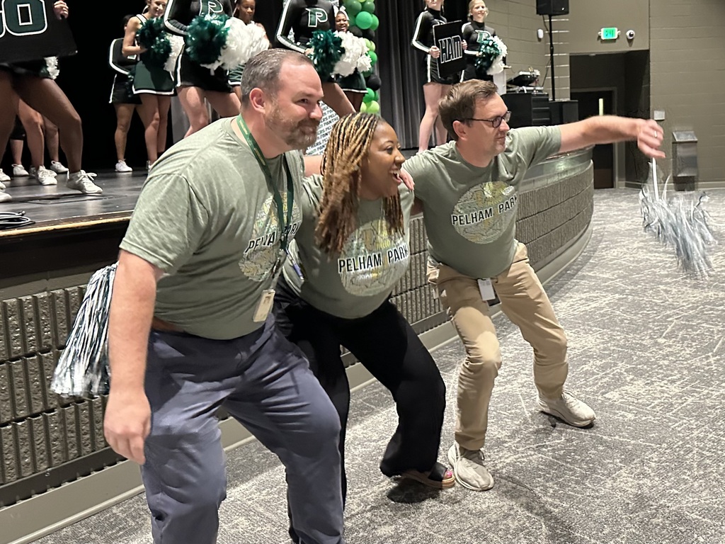 School administrators dancing