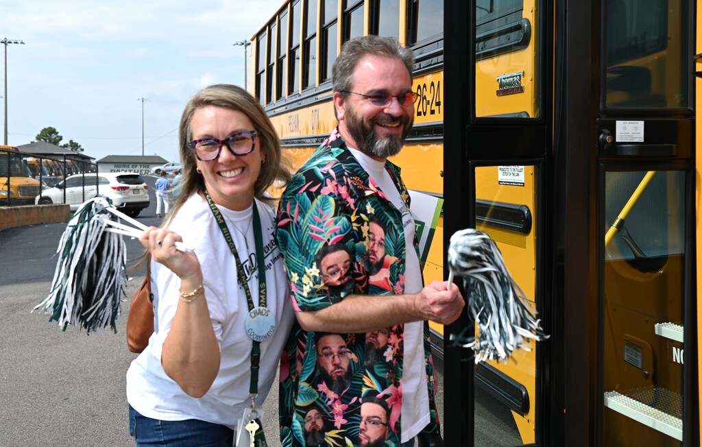 Teachers boarding school bus