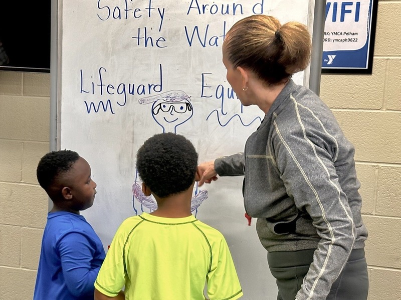 Students with YMCA instructor in the classroom