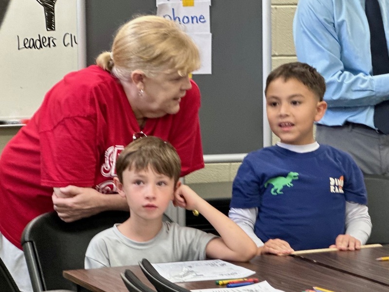 Students with teacher in YMCA classroom