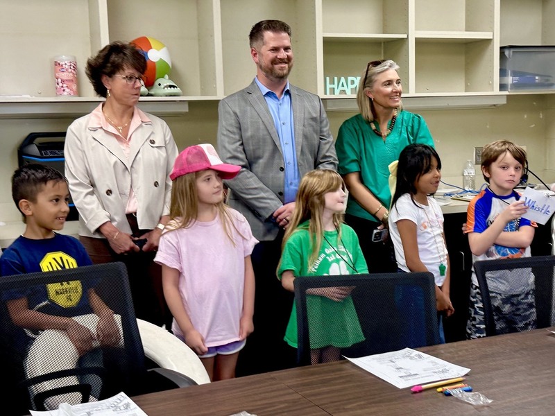 Students with school leaders in the classroom