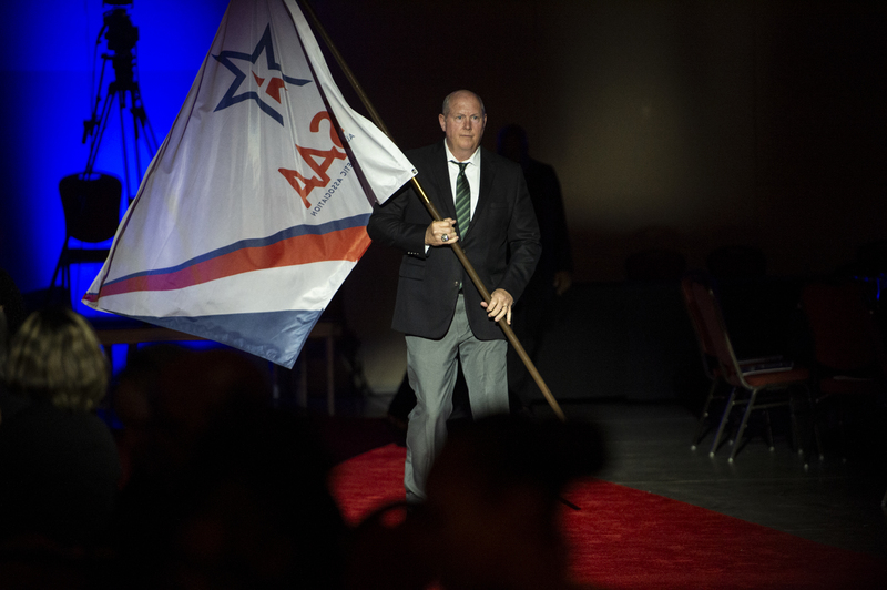 Sean Anderson carrying flag