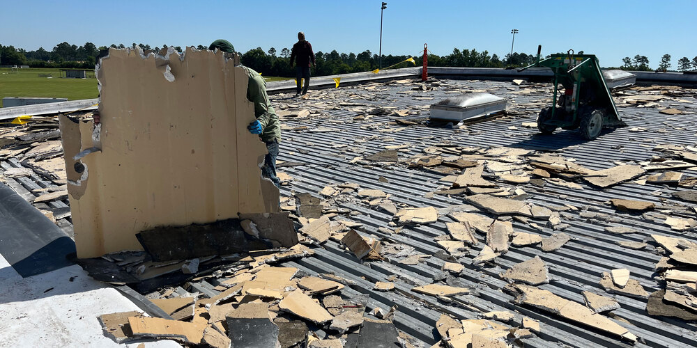 torn up roof of bibby hall at pender high school