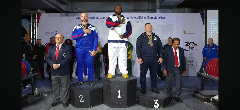 Desmond winning at the powerlifting championship.
