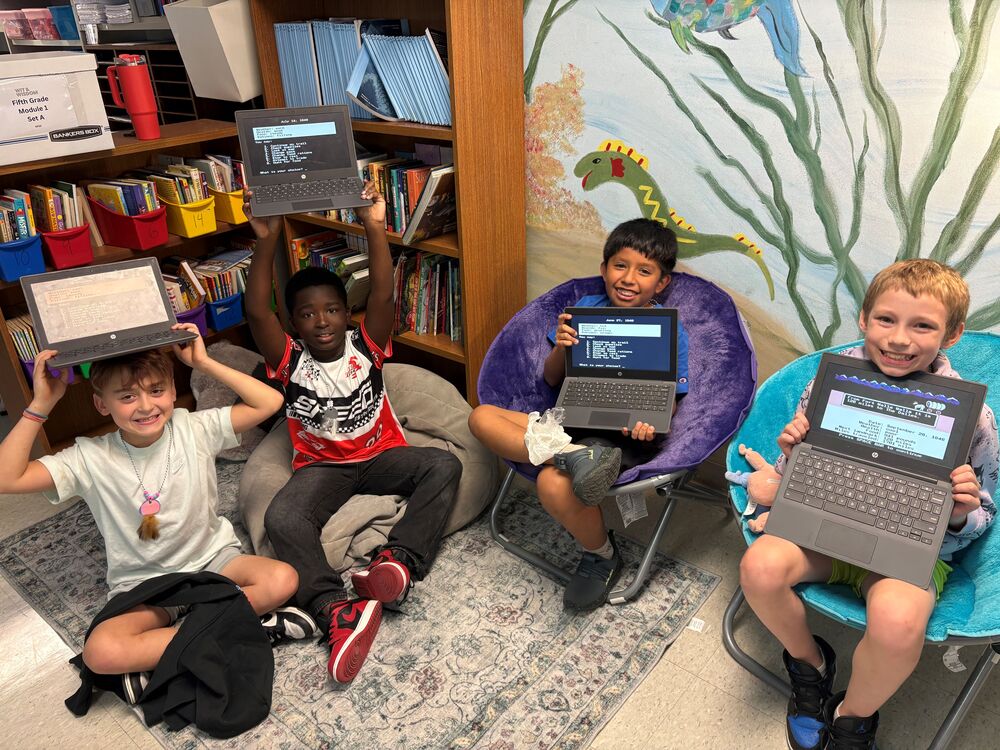 Students playing Oregon Trail