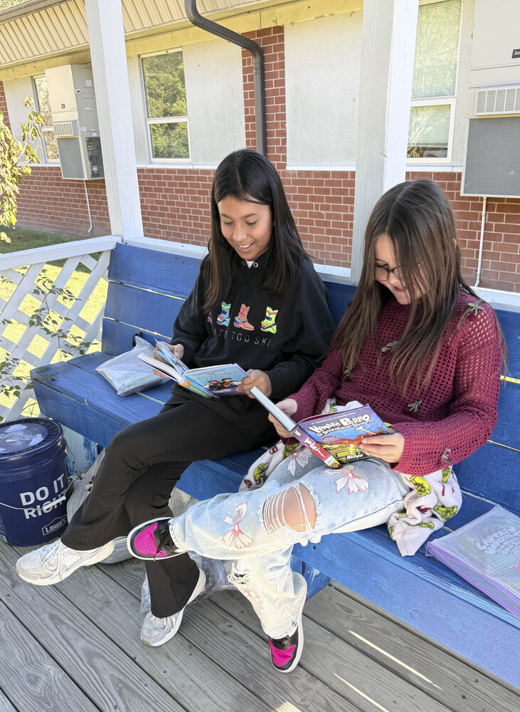 Students reading outside.