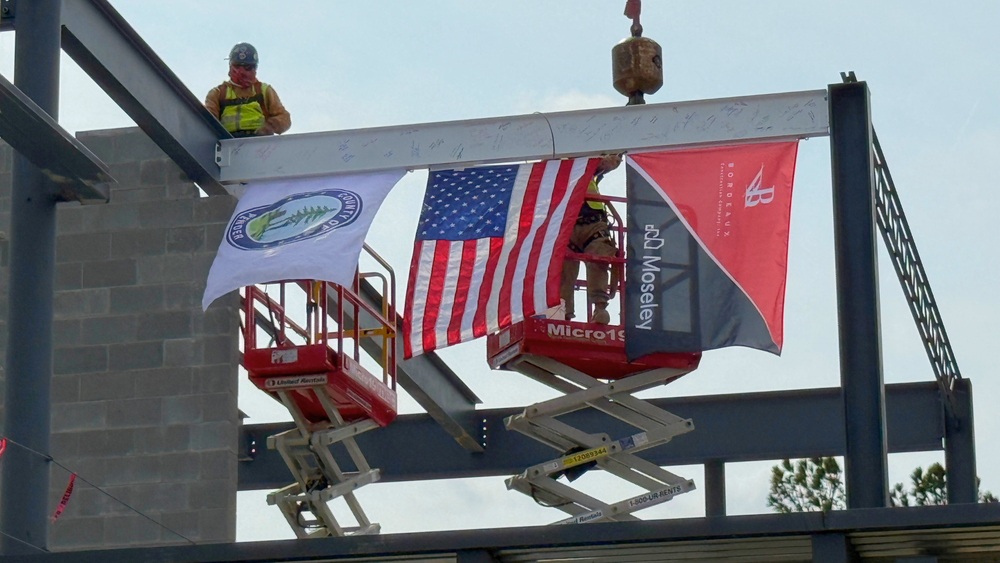 Topping Ceremony Header - Picture of Beam Going into Place