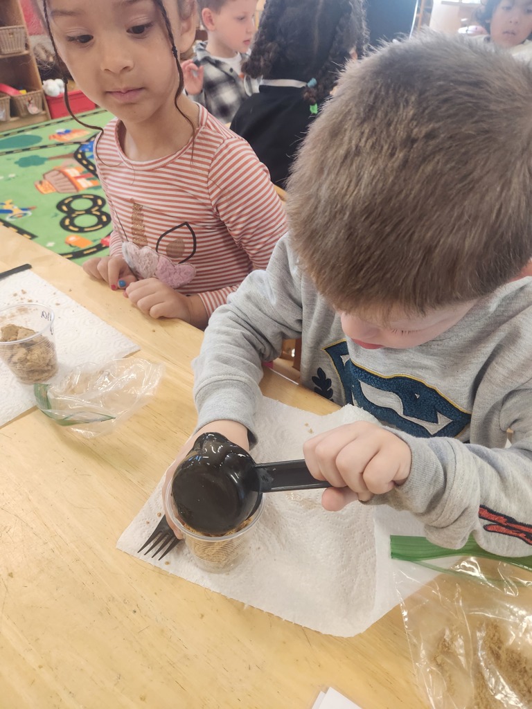 prek making apple pie in a cup