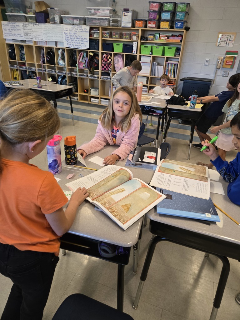 3rd grade students working on a sequencing activity at their desks