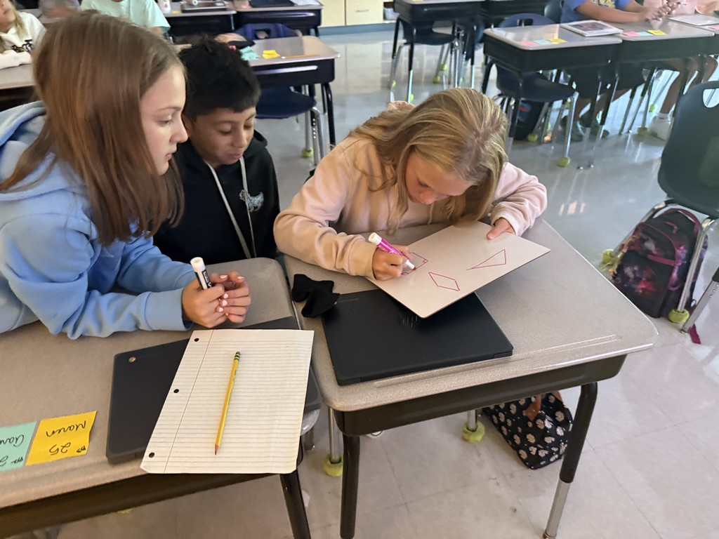 5th grade students working at their desks on math