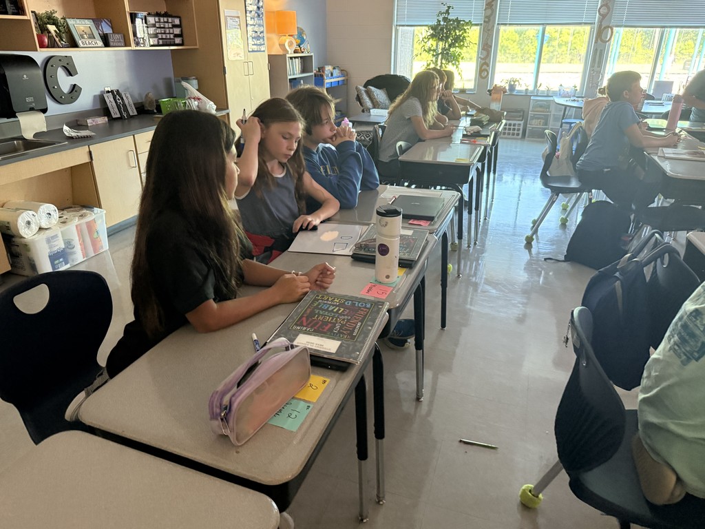 5th grade students working at their desks on math