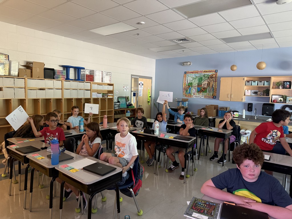 5th grade students working at their desks on math