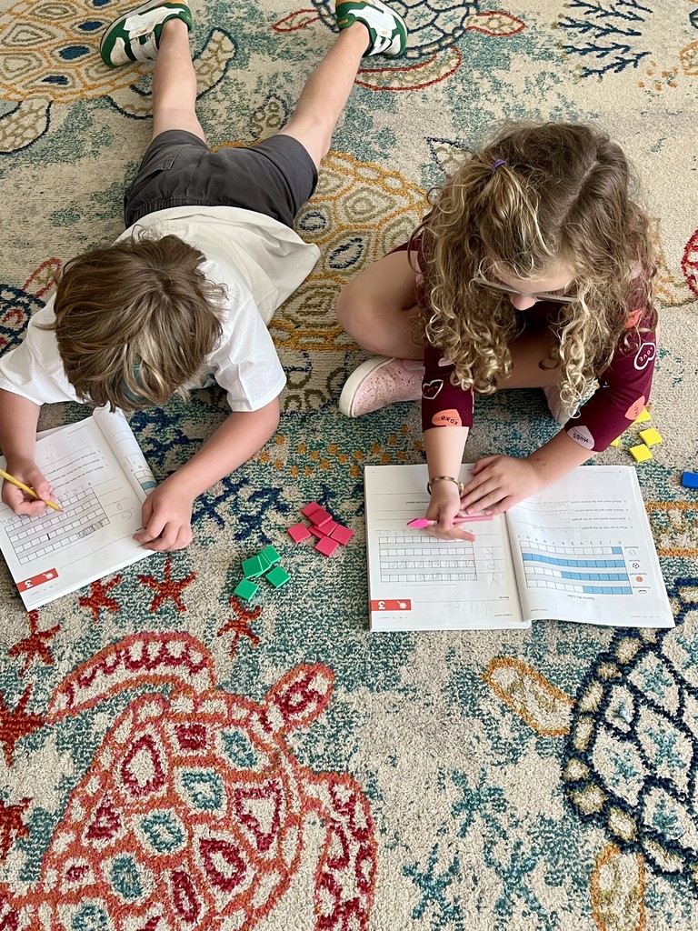 2nd graders working in groups on bar graphs