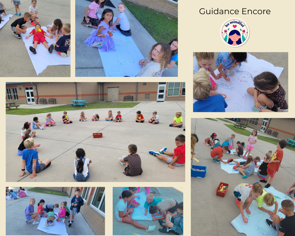 students working outside on a guidacne poster in groups