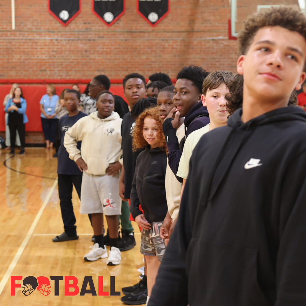 football team at pep rally