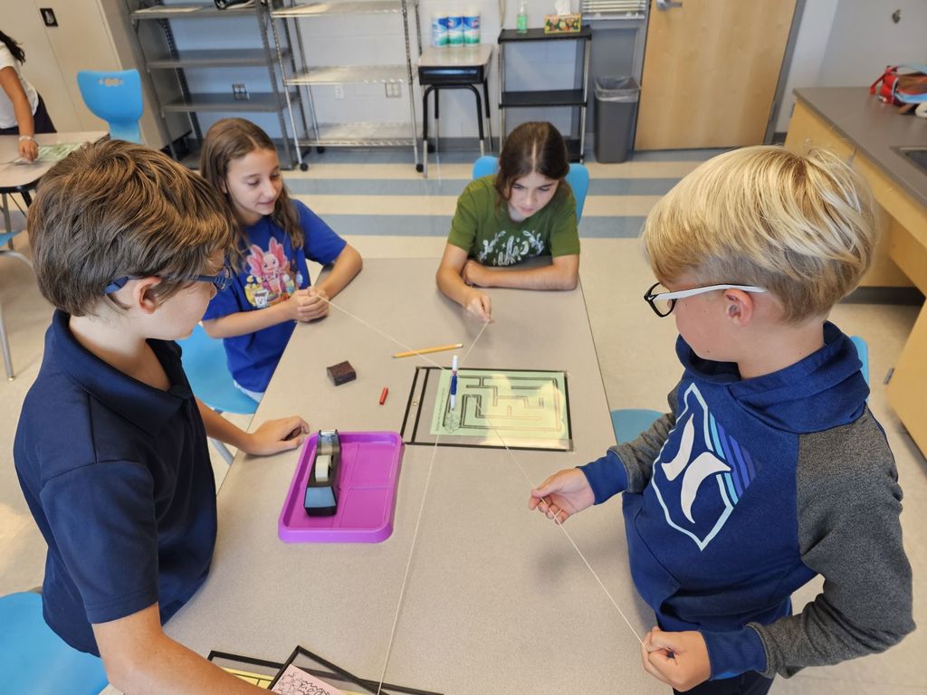 4th and 5th Grade are working on TEAMWORK as they try to help the elephants get to the fruit on a maze. This activity is based on the book That Fruit is Mine and students had to use communication and collaboration to navigate the pens by string on the maze.