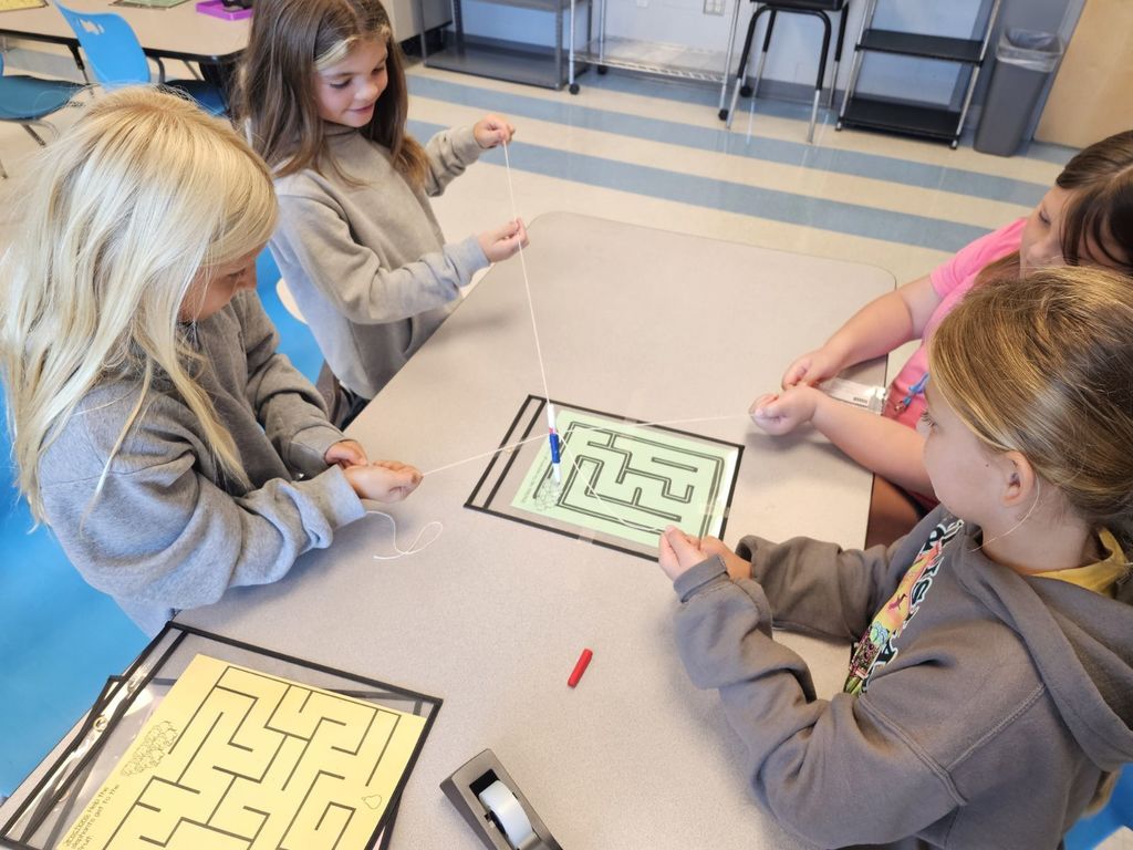 4th and 5th Grade are working on TEAMWORK as they try to help the elephants get to the fruit on a maze. This activity is based on the book That Fruit is Mine and students had to use communication and collaboration to navigate the pens by string on the maze.
