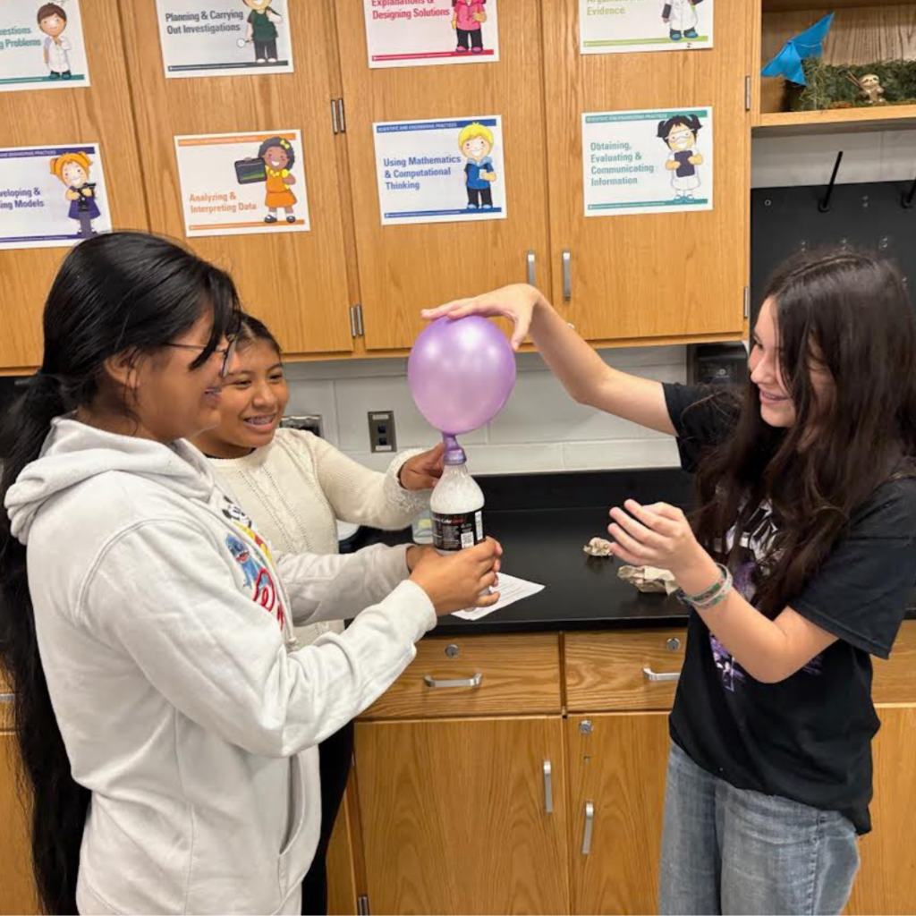 students conducting a science lab in the classroom
