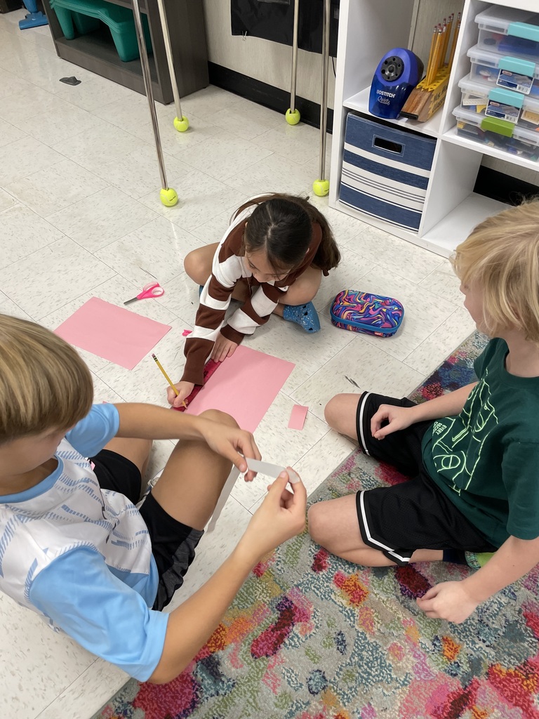 3rd graders working on a project in small groups