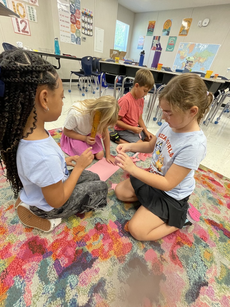 3rd graders working on a project in small groups