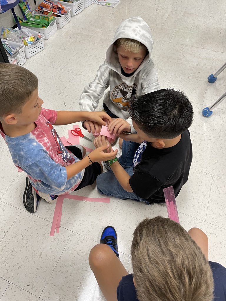 3rd graders working on a project in small groups