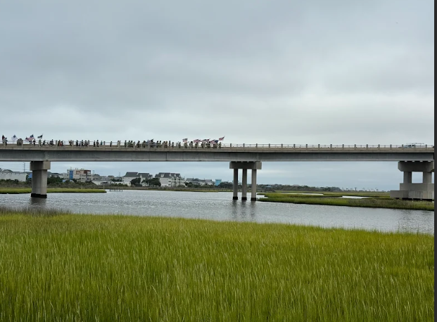 5th graders walking on surf City bridge