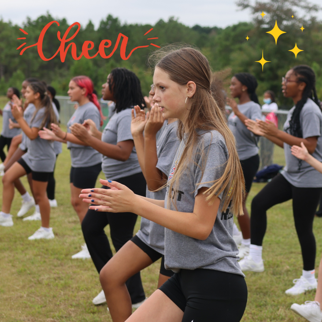 cheerleaders cheering at football game