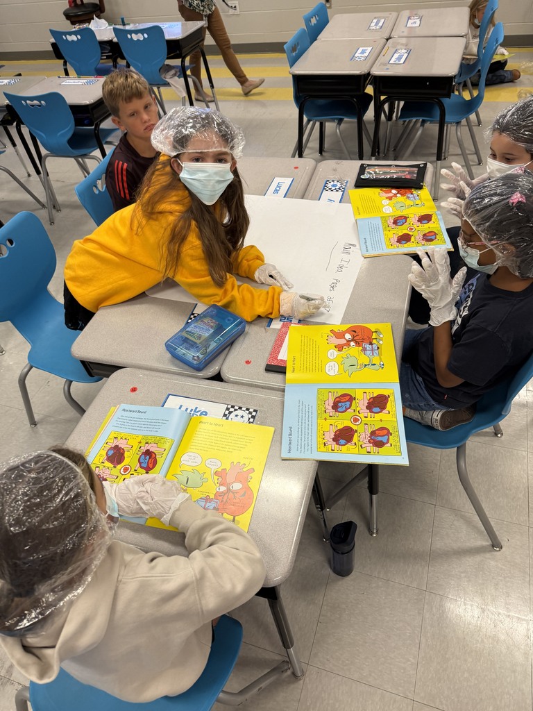 4th grade students working in groups on a circulatory story