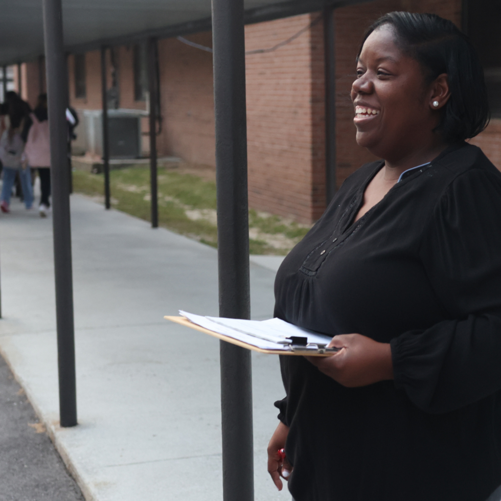 administrator smiling outside