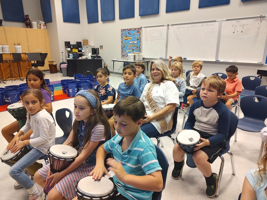 2nd graders playing the djembe in music class