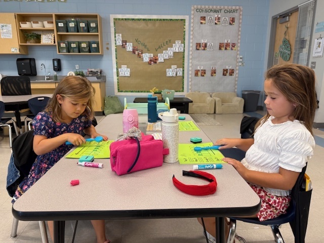 first graders working on spelling at their tables