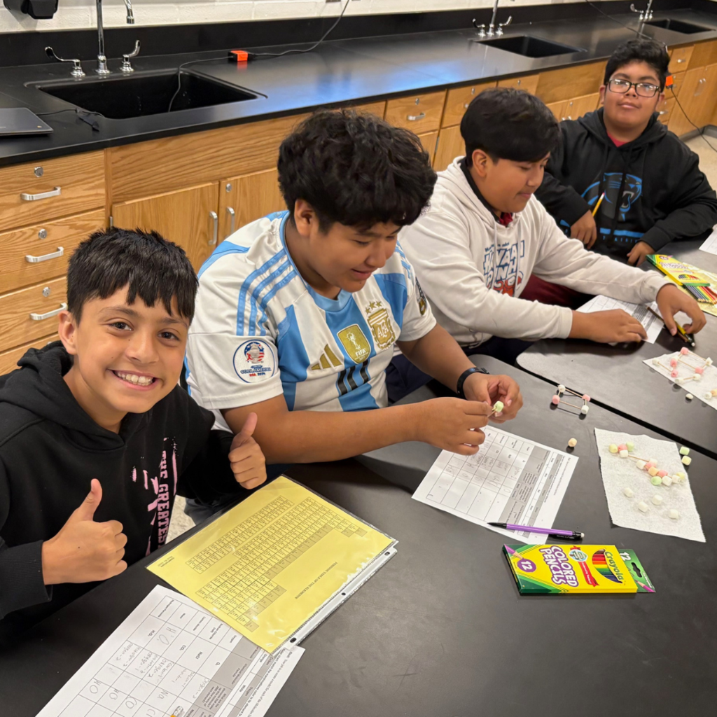 four students working in classroom