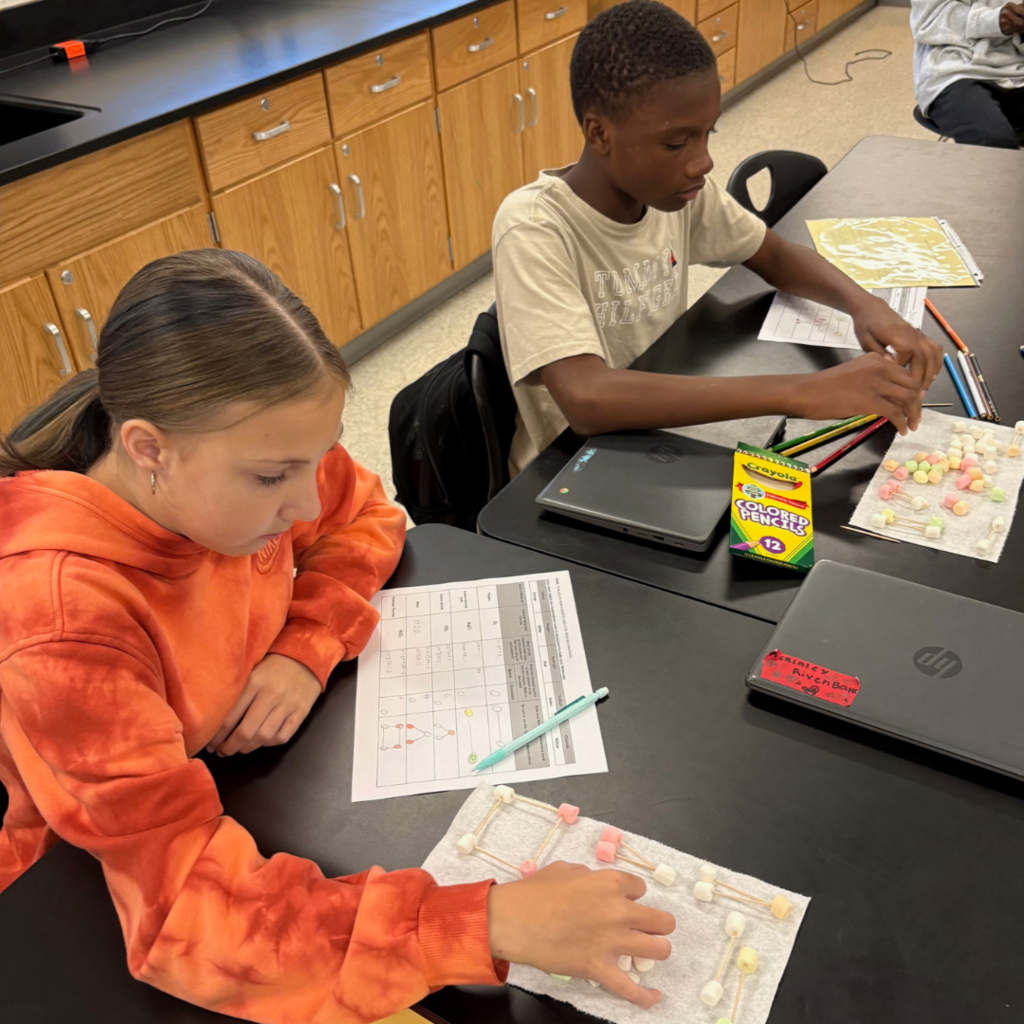 two students working in classroom