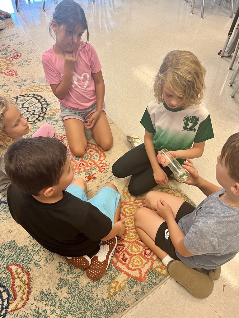 2nd graders discussing weather instruments