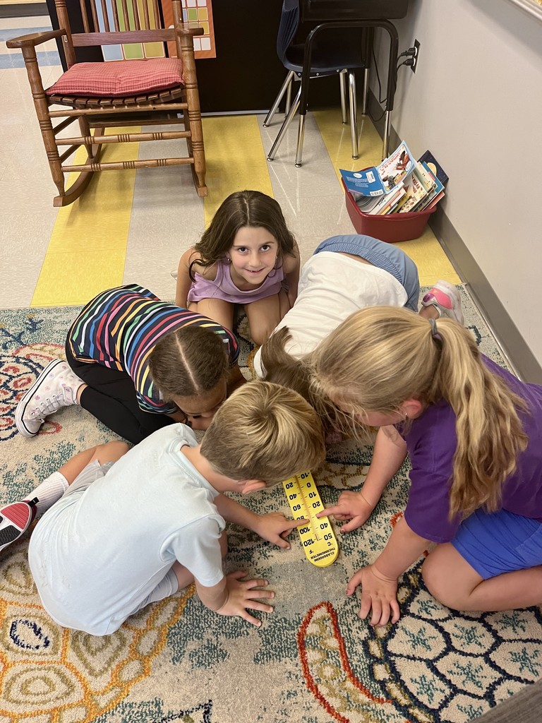 2nd graders discussing weather instruments