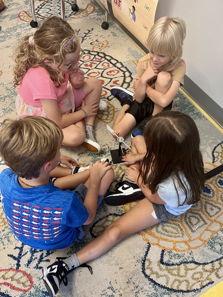 2nd graders discussing weather instruments