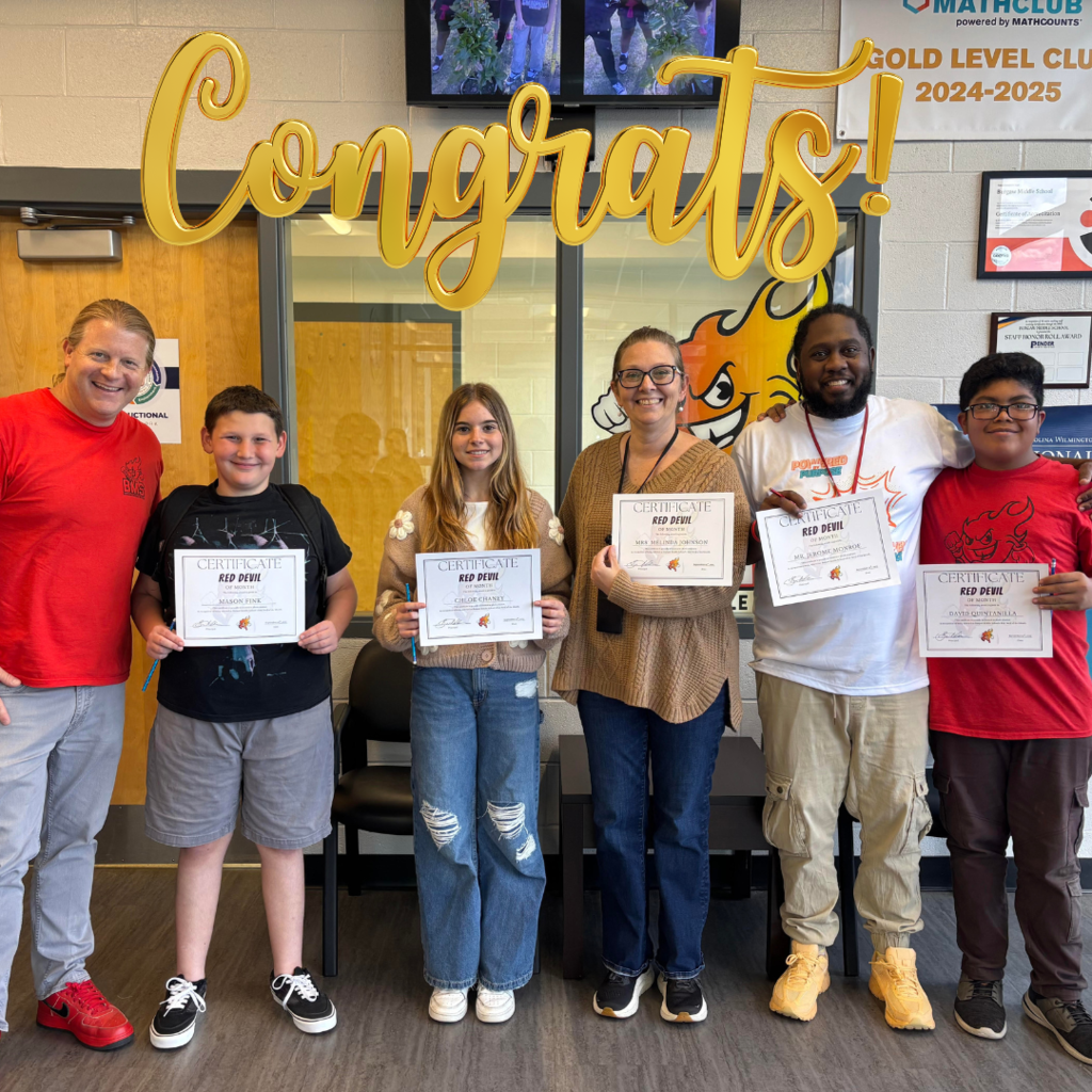 students and staff receiving red devil of the month recognition