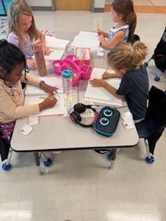 first graders working on math at their tables