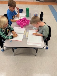 first graders working on math at their tables