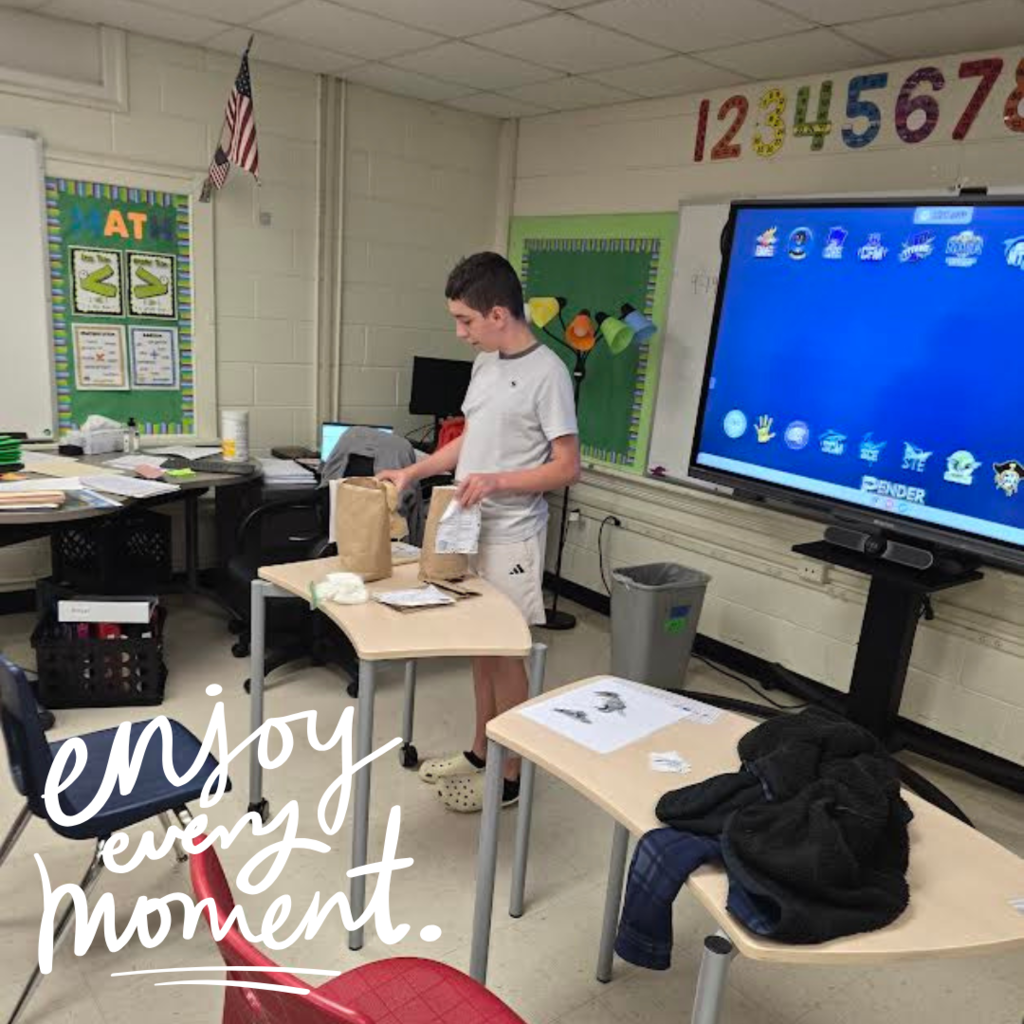 student sharing items with class