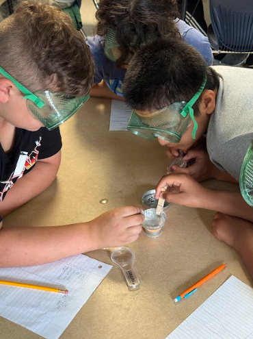 students completing science lab