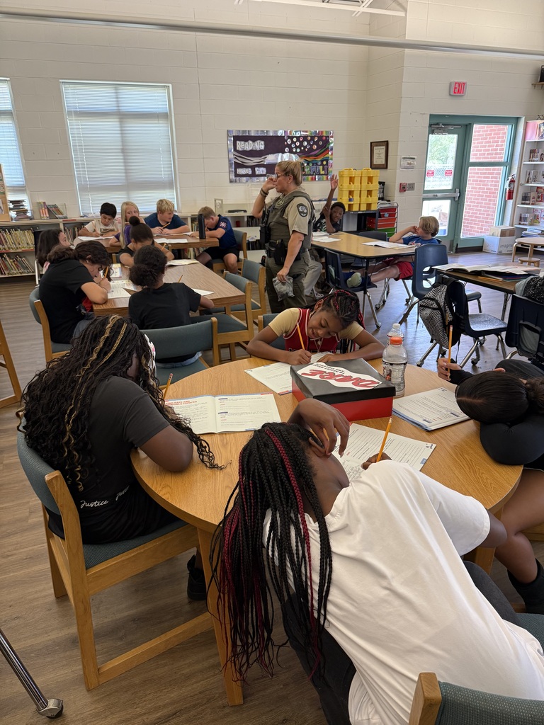 Students at tables learning