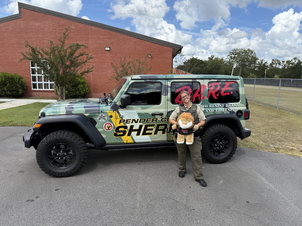 Dare officer by a jeep