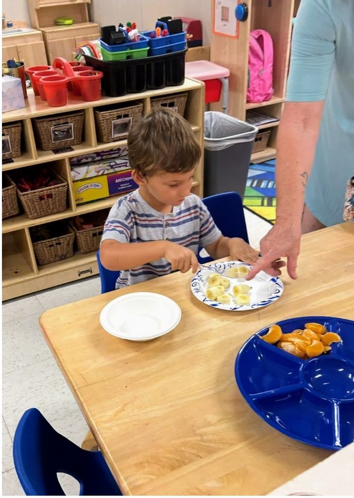 preK students making fruit salad