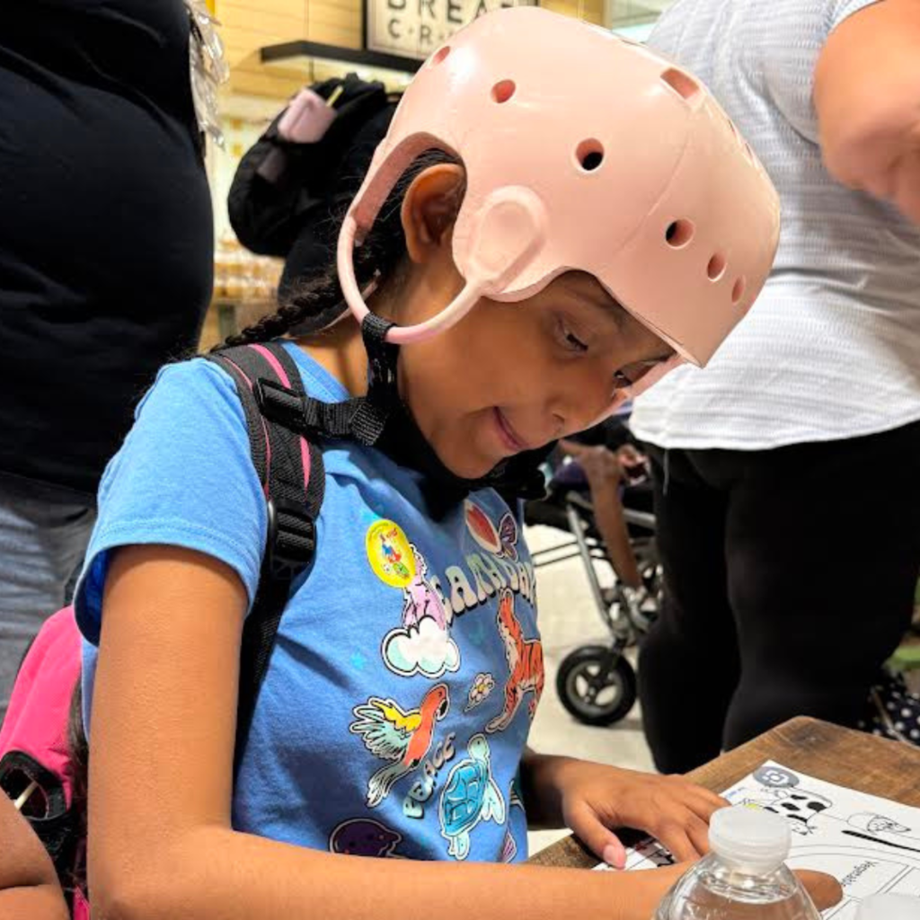 student writing on paper