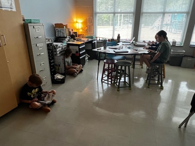 students independently reading in their classrooms