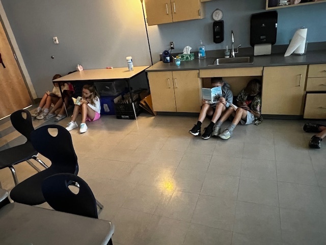 students independently reading in their classrooms