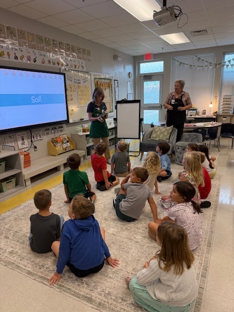 first graders working with the master gardeners 