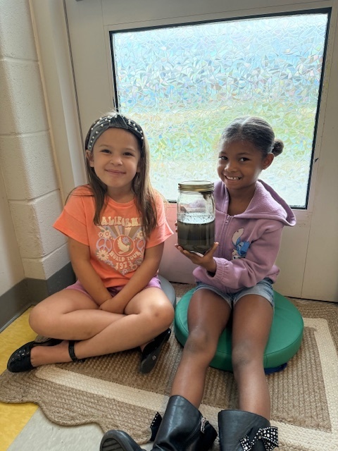 first graders working with the master gardeners 